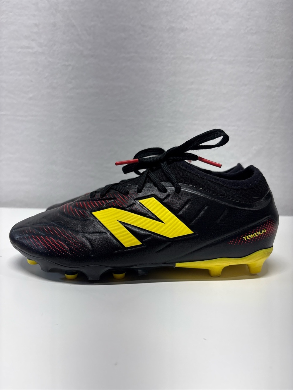 New Balance Tekela Soccer Cleats in Black & Yellow